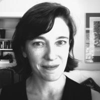 black and white headshot of a smiling woman 