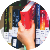 book being removed from a shelf