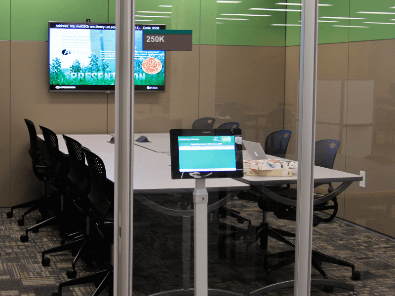 study room with tables, chairs, TV screen