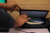 woman scanning a textbook