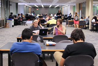 people sitting at study tables and casual seating chairs