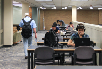 people sitting at study tables