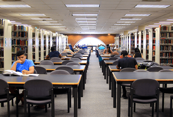 people sitting at study tables and chairs